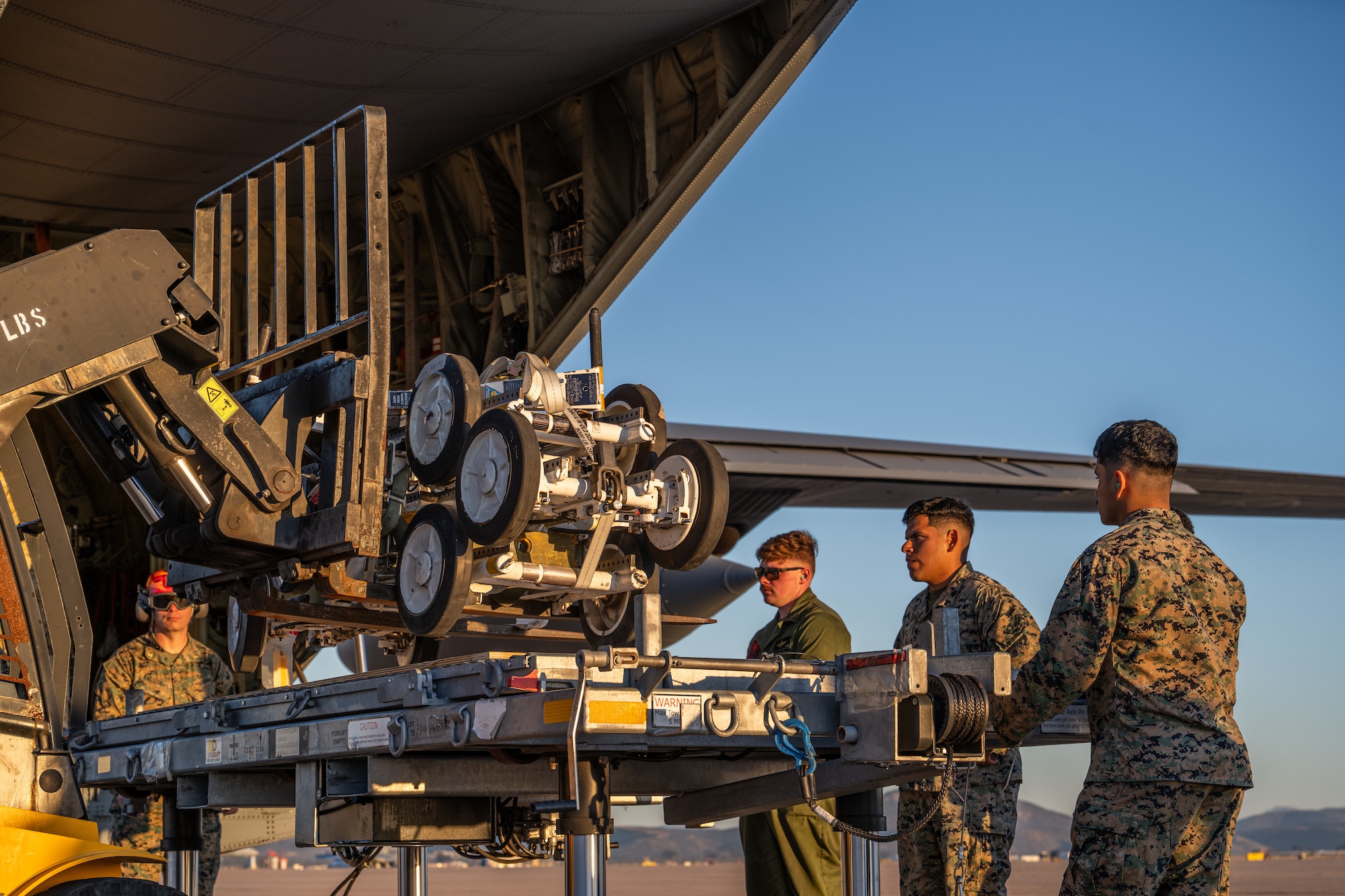 Airmen and Marines work together out on the flightline