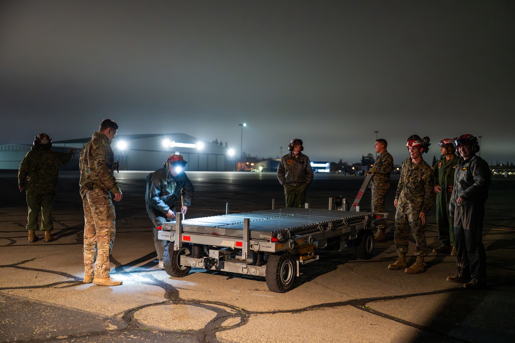 Airmen and Marines work together out on the flightline