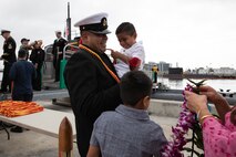 (Sept. 29, 2025) A Sailor assigned to Los Angeles-class fast-attack submarine USS Santa Fe (SSN 763) is welcomed home after returning to Naval Base Point Loma following a six-month deployment to the U.S. Indo-Pacific Command area of responsibility, Sept. 29, 2025. Santa Fe is assigned to Commander, Submarine Squadron 11, home to four Los Angeles-class fast-attack submarines, which are capable of supporting various missions, including anti-submarine warfare, anti-ship warfare, strike warfare and intelligence, surveillance and reconnaissance. (U.S. Navy photo by Mass Communication Specialist 2nd Class Rashan Jefferson)