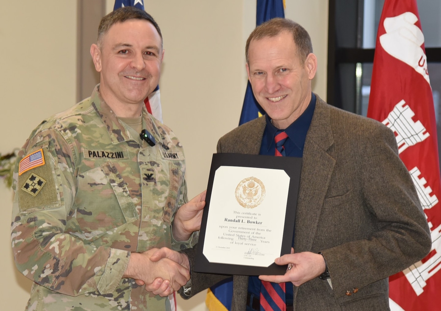 Col. Jeffrey Palazzini, district commander, presented a certificate of retirement to Randy Bowker, deputy district engineer and director of programs and project management, in a ceremony at the district headquarters on Dec. 16, 2025.