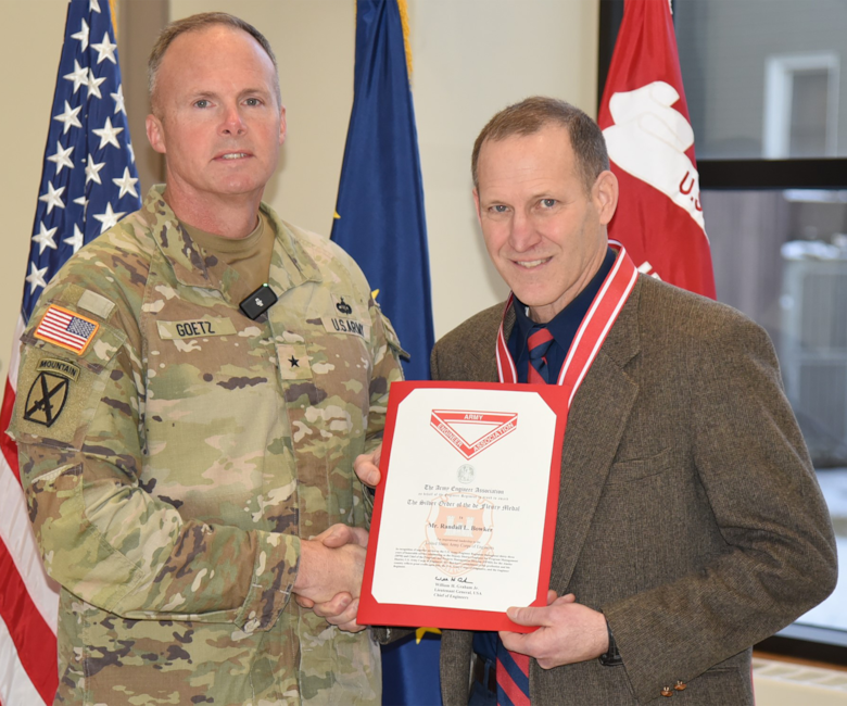 Brig. Gen. Joseph "Clete" Goetz, commanding general of the Pacific Ocean Division, presented the Silver Order of the de Fleury Medal to Randy Bowker, deputy district engineer and director of programs and project management, during his retirement ceremony on Dec. 16, 2025.