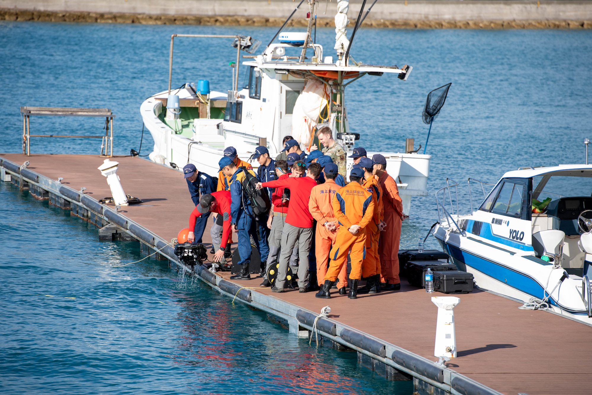 Service member showcase gear to local coast guard.