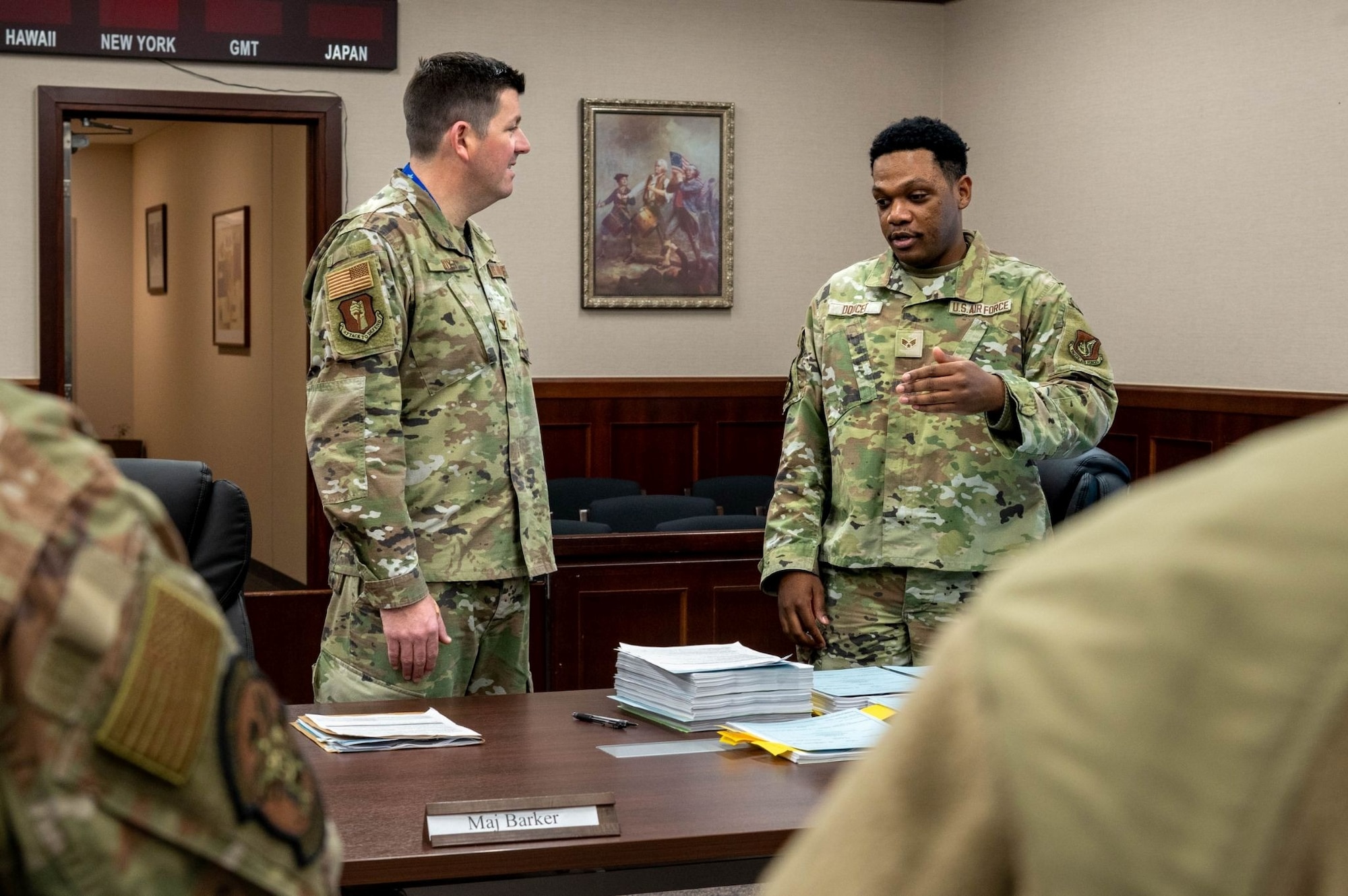 U.S. Air Force Senior Airman Khaleb Doucet, right, 35th Fighter Wing (FW) Judge Advocate adverse actions paralegal, talks with Col. Matthew Hoyt, 35th FW deputy commander, during a Wild Weasel Walk-through at Misawa Air Base, Japan, Dec. 15, 2025.