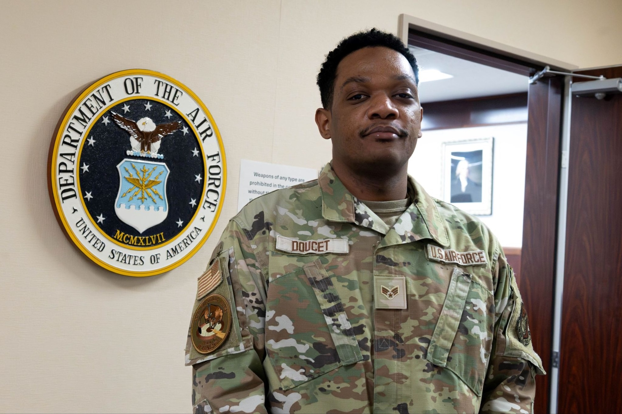 U.S. Air Force Senior Airman Khaleb Doucet, 35th Fighter Wing (FW) Judge Advocate adverse actions paralegal, poses for a photo at Misawa Air Base, Japan, Dec.15, 2025.