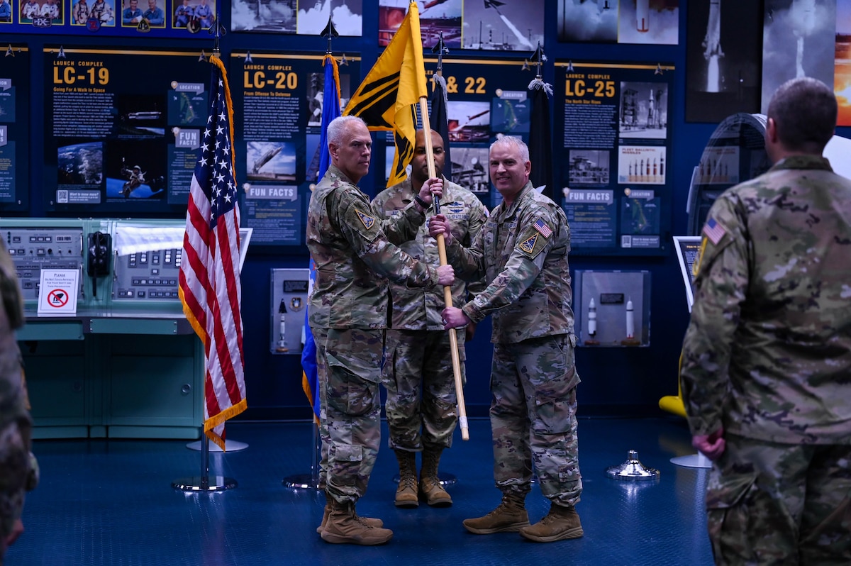 U.S. Space Force Col. Ryan Hiserote assumes command of System Delta 80 from Lt. Gen. Philip Garrant during a stand-up ceremony at Cape Canaveral Space Force Station, Fla., Dec. 12. SYD 80 will procure, integrate, and execute launch solutions, on-orbit servicing, and range systems. (U.S. Space Force photo/SrA Samuel Becker)