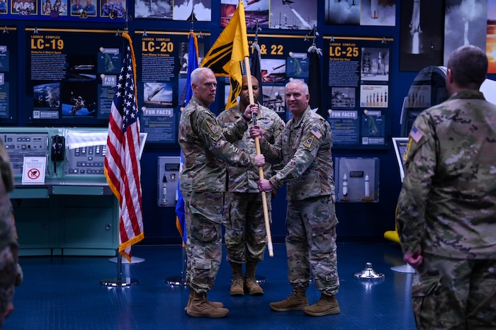 U.S. Space Force Col. Ryan Hiserote assumes command of System Delta 80 from Lt. Gen. Philip Garrant during a stand-up ceremony at Cape Canaveral Space Force Station, Fla., Dec. 12. SYD 80 will procure, integrate, and execute launch solutions, on-orbit servicing, and range systems. (U.S. Space Force photo/SrA Samuel Becker)