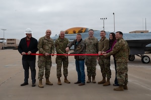 Goodfellow Air Force Base commander and the county judge, also an honorary commander, cut the ribbon during the unveiling ceremony.