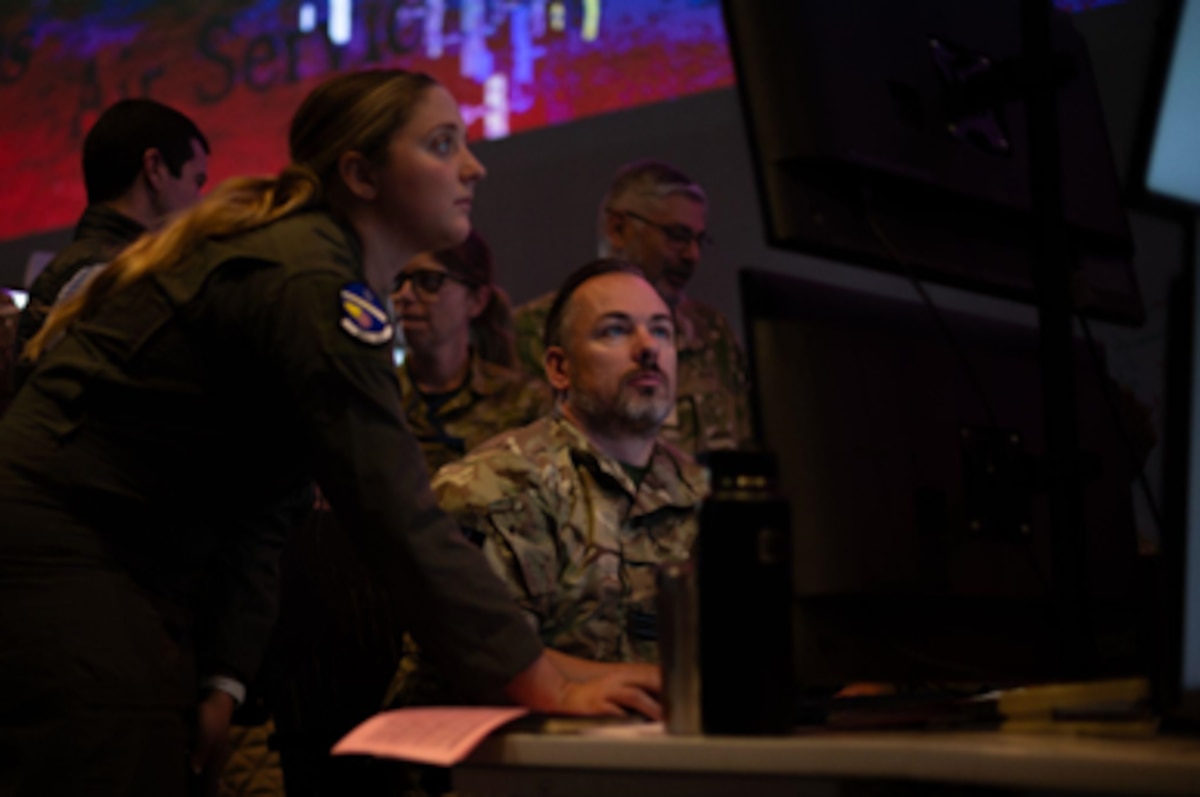 photo of RAF and USAF warfighters working on computers