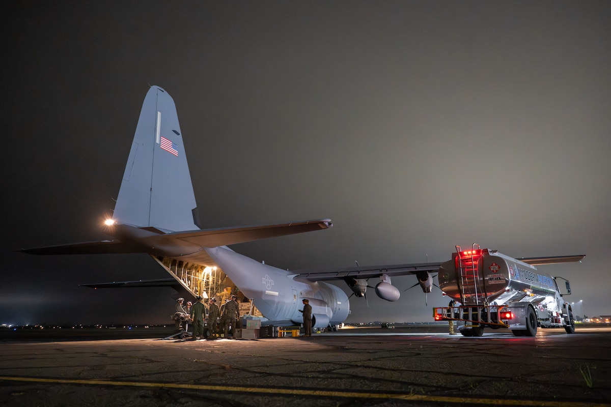 Airmen and Marines work together out on the flightline