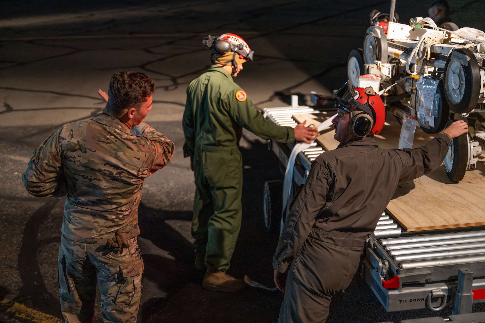 Airmen and Marines work together out on the flightline