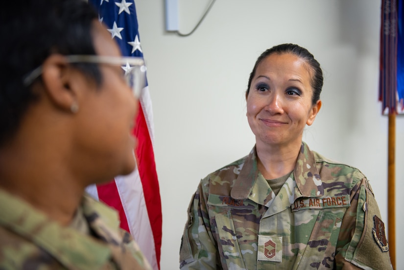 Chief Master Sgt. Marie Plaza, senior enlisted leader for the 123rd Medical Group, speaks with an Airman at the Kentucky Air National Guard Base in Louisville, Ky., April, 12, 2025. Plaza recently earned the Air National Guard Senior Non-commissioned Officer Leadership Award in the 2024 Air National Guard Medical Service Awards. (U.S. Air National Guard photo by Angelee Barnett)