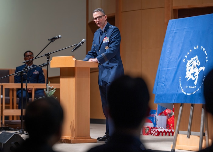 U.S. Air Force Maj. Gen. Trent Davis, Chief of Chaplains for the U.S. Air Force, reflects on Operation Kiddy Car during a ceremony at Osan Air Base, Republic of Korea, Dec. 17, 2025. Operation Kiddy Car is a historic humanitarian mission that occurred on Dec. 20, 1950, when U.S. Air Force Lt. Col. Russell Blaisdell, a chaplain, and Staff Sgt. Merle Strang worked together to rescue more than 1,000 Korean orphans and their caretakers from war-torn Seoul. The actions of Blaisdell and Strang exemplified courage, compassion, and decisive leadership in the face of crisis, showcasing the core mission of the Chaplain Corps by safeguarding innocent lives amid chaos and uncertainty. (U.S. Air Force photo by Staff Sgt. Sarah Williams)