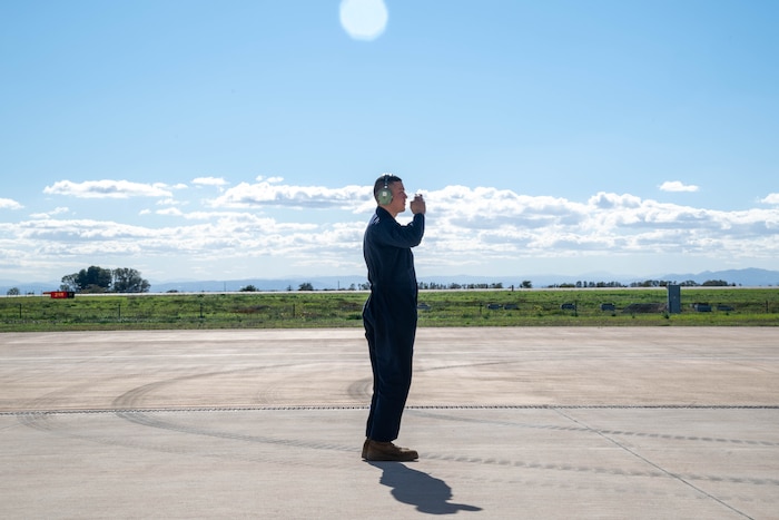 crew chief salutes to an aircraft
