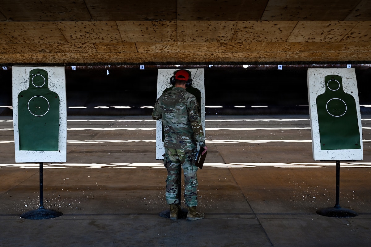 man grades shooting score sheet