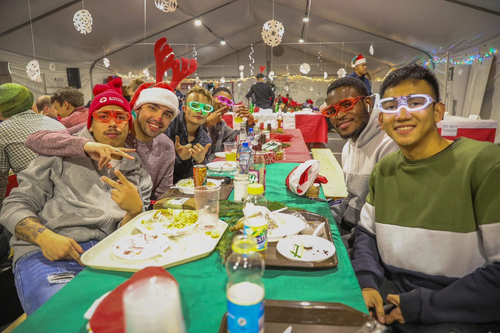 U.S. Soldiers assigned to 1st Infantry Division (1 ID) enjoy food and gifts during a Christmas party at Boleslawiec, Poland, Dec. 25, 2022. Defense Logistics Agency Subsistence supply chain helps to keep morale high by giving servicemembers around the globe the smells and tastes of the December holidays.  (U.S. Army National Guard photo by Spc. Kevin T. Brown Jr.)