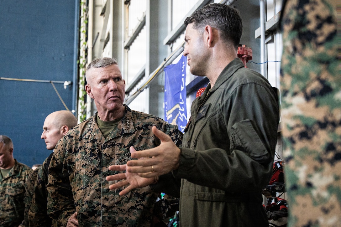 The 39th Commandant of the Marine Corps, Gen. Eric M. Smith, left, speaks to  the executive officer of Marine Fighter Attack Squadron (VMFA) 225, U.S. Marine Corps Forces, South, at Jose Aponte de la Torre Airport in Ceiba, Puerto Rico, Dec. 16, 2025. U.S. military forces are deployed to the Caribbean in support of the U.S. Southern Command mission, Department of War-directed operations, and the president’s priorities to disrupt illicit drug trafficking and protect the homeland. (U.S. Marine Corps photo)