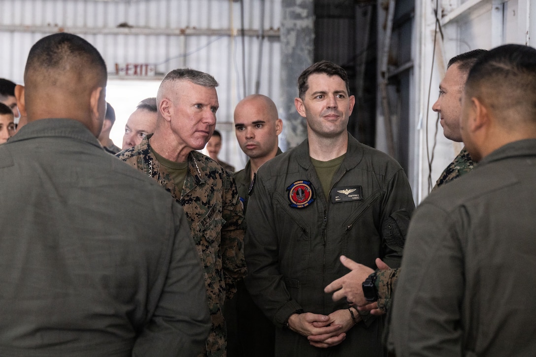The 39th Commandant of the Marine Corps, Gen. Eric M. Smith, left, speaks to maintenance control Marines with Marine Fighter Attack Squadron (VMFA) 225, U.S. Marine Corps Forces, South, at Jose Aponte de la Torre Airport in Ceiba, Puerto Rico, Dec. 16, 2025. U.S. military forces are deployed to the Caribbean in support of the U.S. Southern Command mission, Department of War-directed operations, and the president’s priorities to disrupt illicit drug trafficking and protect the homeland. (U.S. Marine Corps photo)