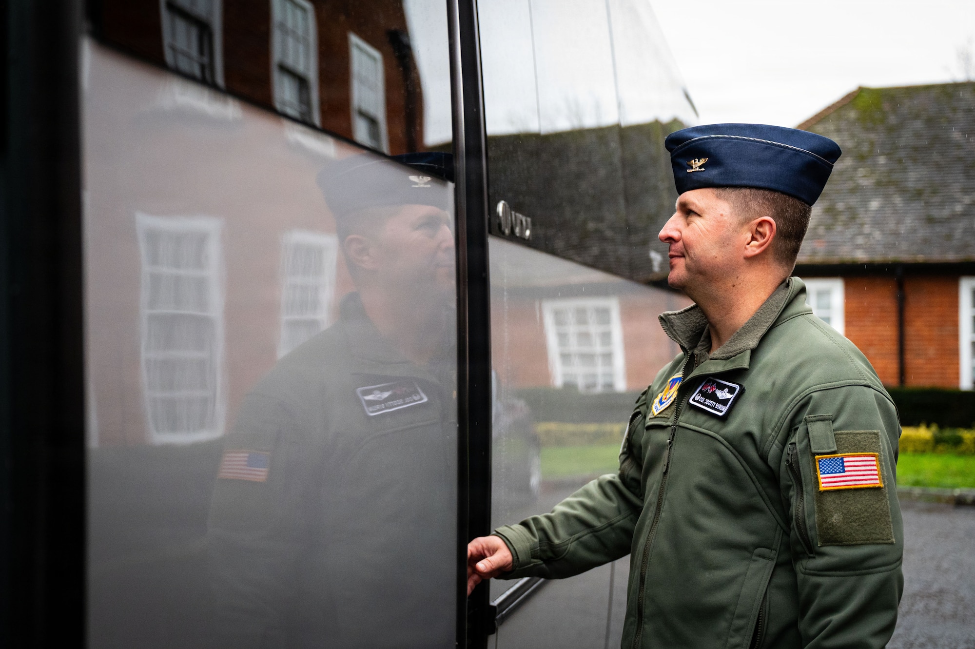 U.S. Air Force Col. Steven Byrum, 100th Air Refueling Wing commander, enters a bus to meet professional staff members of the Senate Armed Services Committee at RAF Mildenhall, England, Dec. 16, 2025.