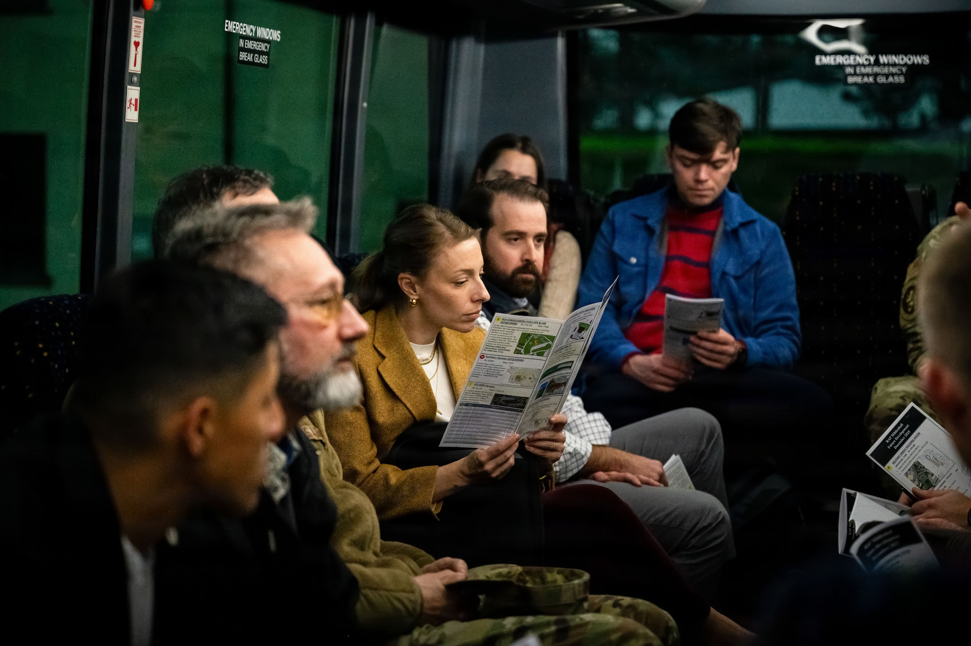 Brad Patout, center right, professional staff member and readiness subcommittee lead on the Senate Armed Services Committee, and Maureen Fromuth, center left, professional staff member of the SASC, listen to a brief during a distinguished visitor tour at RAF Mildenhall, England, Dec. 16, 2025.