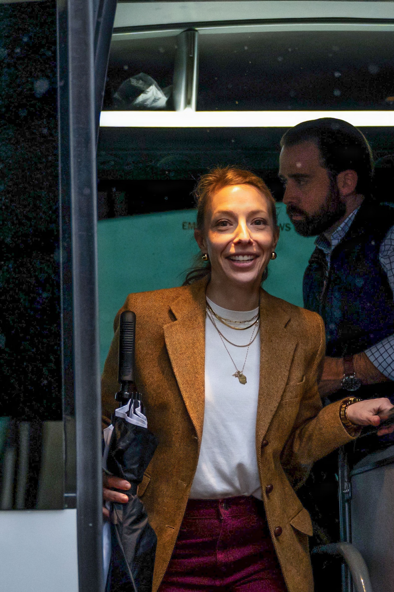 Maureen Fromuth, professional staff member of the Senate Armed Services Committee, exits a bus during a distinguished visitor tour at RAF Mildenhall, England, Dec. 16, 2025.