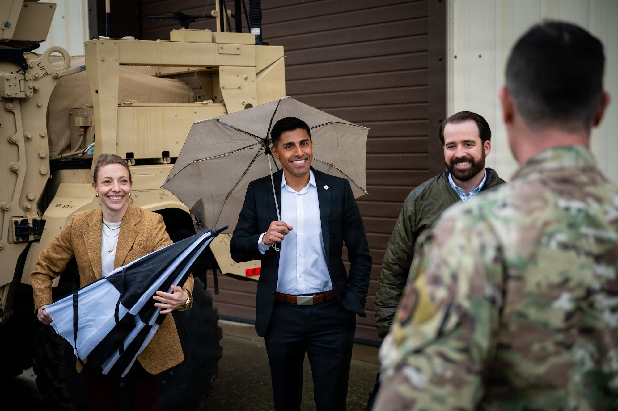 From left, Maureen Fromuth, professional staff member of the Senate Armed Services Committee, U.S. Air Force Major Juan Gonzalez, Headquarters Air Force legislative liaison, and Brad Patout, professional staff member and readiness subcommittee lead on the SASC, listens to a brief during a distinguished visitor tour at RAF Mildenhall, England, Dec. 16, 2025.