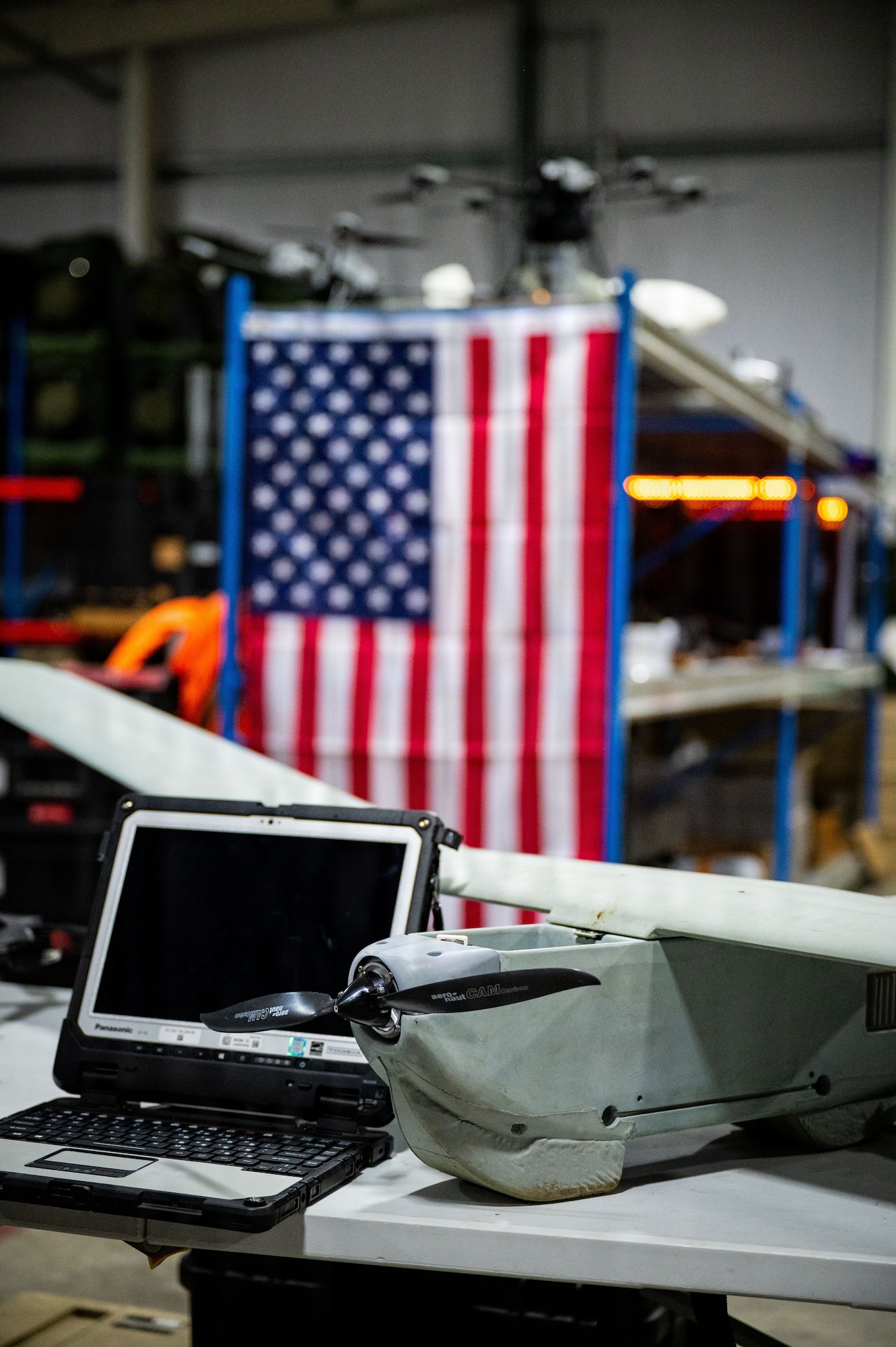 A RQ-20 Puma assigned to the 352nd Special Operations Wing sits on a table during a demonstration of the SOW's drone capabilities for the professional staff members of the Senate Armed Services Committee at RAF Mildenhall, England, Dec. 16, 2025.