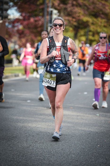 Tech. Sgt. Kathryn Parker, 446th Airlift Wing public affairs specialist, runs in the Marine Corps Marathon in Arlington, Virginia, on Oct. 26, 2025.