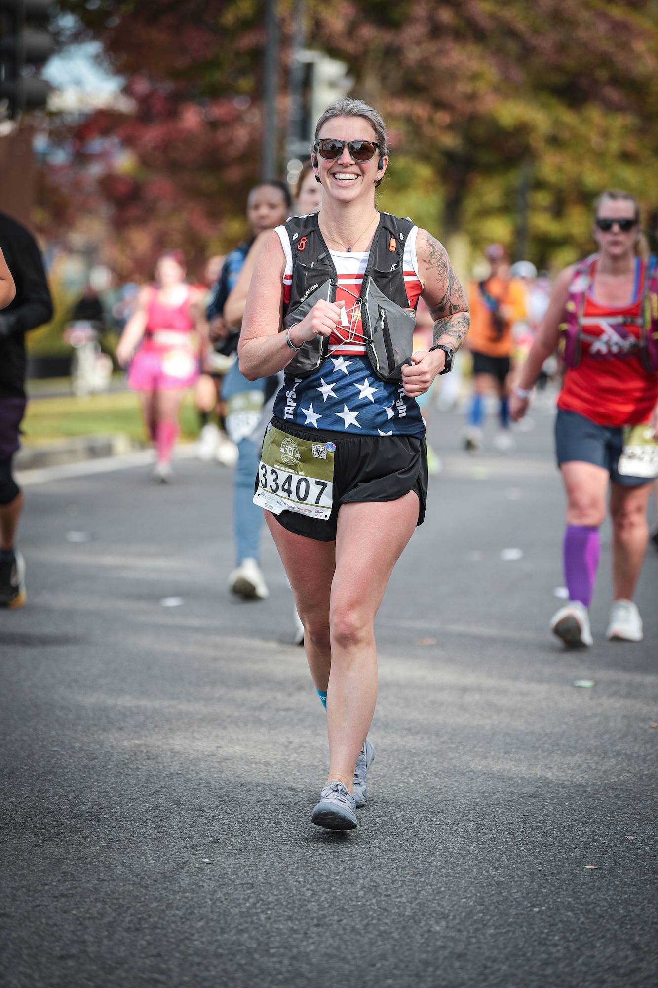 Tech. Sgt. Kathryn Parker, 446th Airlift Wing public affairs specialist, runs in the Marine Corps Marathon in Arlington, Virginia, on Oct. 26, 2025.