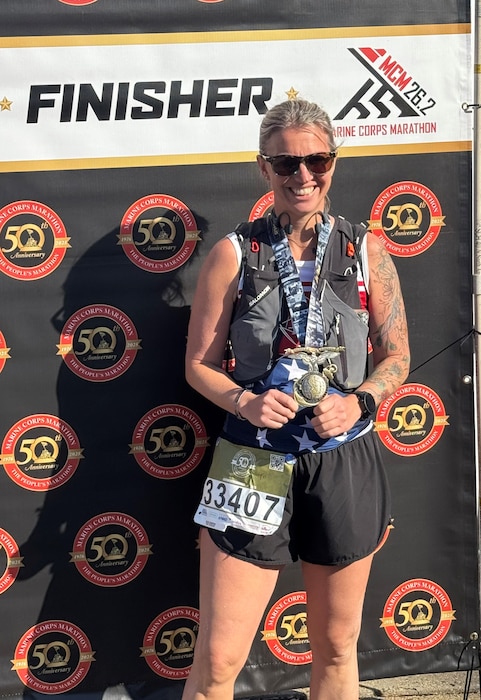Tech. Sgt. Kathryn Parker, 446th Airlift Wing public affairs specialist, poses for a photo after the Marine Corps Marathon in Arlington, Virginia, on Oct. 26, 2025.