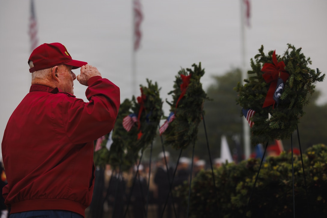 A U.S. military veteran renders a salute during the Wreaths Across America ceremony at Miramar National Cemetery, San Diego, California, Dec. 13, 2025. Wreaths Across America honors and remember our nation's fallen service members while recognizing the profound sacrifices made by their families. The organization strives to inspire the next generation to cherish the value of freedom, reminding them that it comes at a great cost and is preserved by the selfless acts of many. (U.S. Marine Corps photo by Sgt. Fourmet Gustavsen)