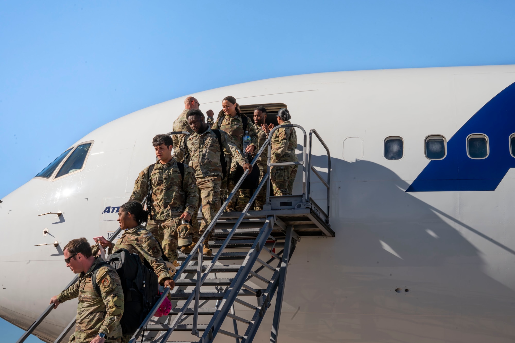 U.S. Air Force Airmen return from a deployment with the 11th Air Task Force at Davis-Monthan Air Force Base, Arizona, Dec. 17, 2025. Airmen returned from a five-month deployment to support the 11th ATF’s inaugural deployment. (U.S. Air Force photo by Airman 1st Class Samantha Melecio)