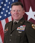 Image of Brig. Gen. Christopher Piland command photo in Army Green Service Uniform with U.S. flag and maroon one white star flag in background