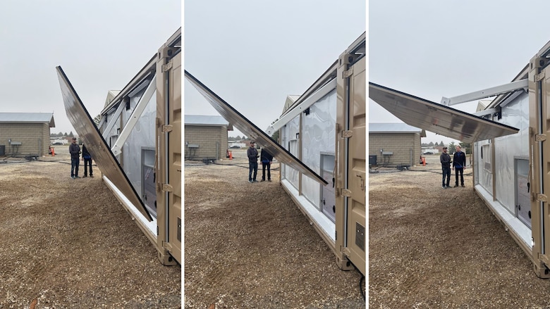 ERDC Researcher Dr. Aaron Petri deploys one of the energy node’s photovoltaic (PV) panels.