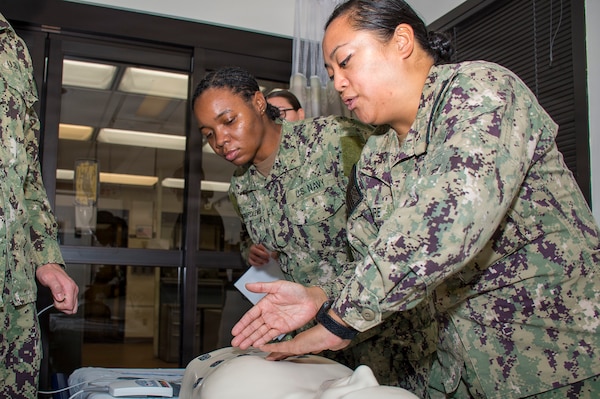 Hands on enhancement… Navy Medicine Readiness Training Command Bremerton assigned to 
Expeditionary Medical Facility Bravo, receive proficiency training in Naval Hospital Bremerton’s Urgent Care Setting as part of Battle Ready Training Tuesday, a command-wide initiative focused on providing preparatory medical skill training primarily for hospital corpsman yet open to all staff members (Official Navy photo by Mass Communication Specialist 2nd Class Jennifer Benedict, NHB/NMRTC Bremerton public affairs).