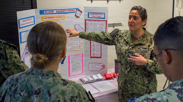 Mastering the movement…blood transfusion procedures are thoroughly explained during a recent Battle Ready Training Tuesday at Navy Medicine Readiness Training Command Bremerton. 
The training session - provided by experienced providers, nurses, and corpsmen - instructed and guided those in attendance through a challenging simulation environment to hone their skill levels in the crucial medical procedure. The training is a command-wide initiative focused on providing preparatory skills training primarily for hospital corpsman yet open to all staff members (official Navy photo by Mass Communication Specialist 2nd Class Jennifer Benedict, NHB/NMRTC Bremerton public affairs).