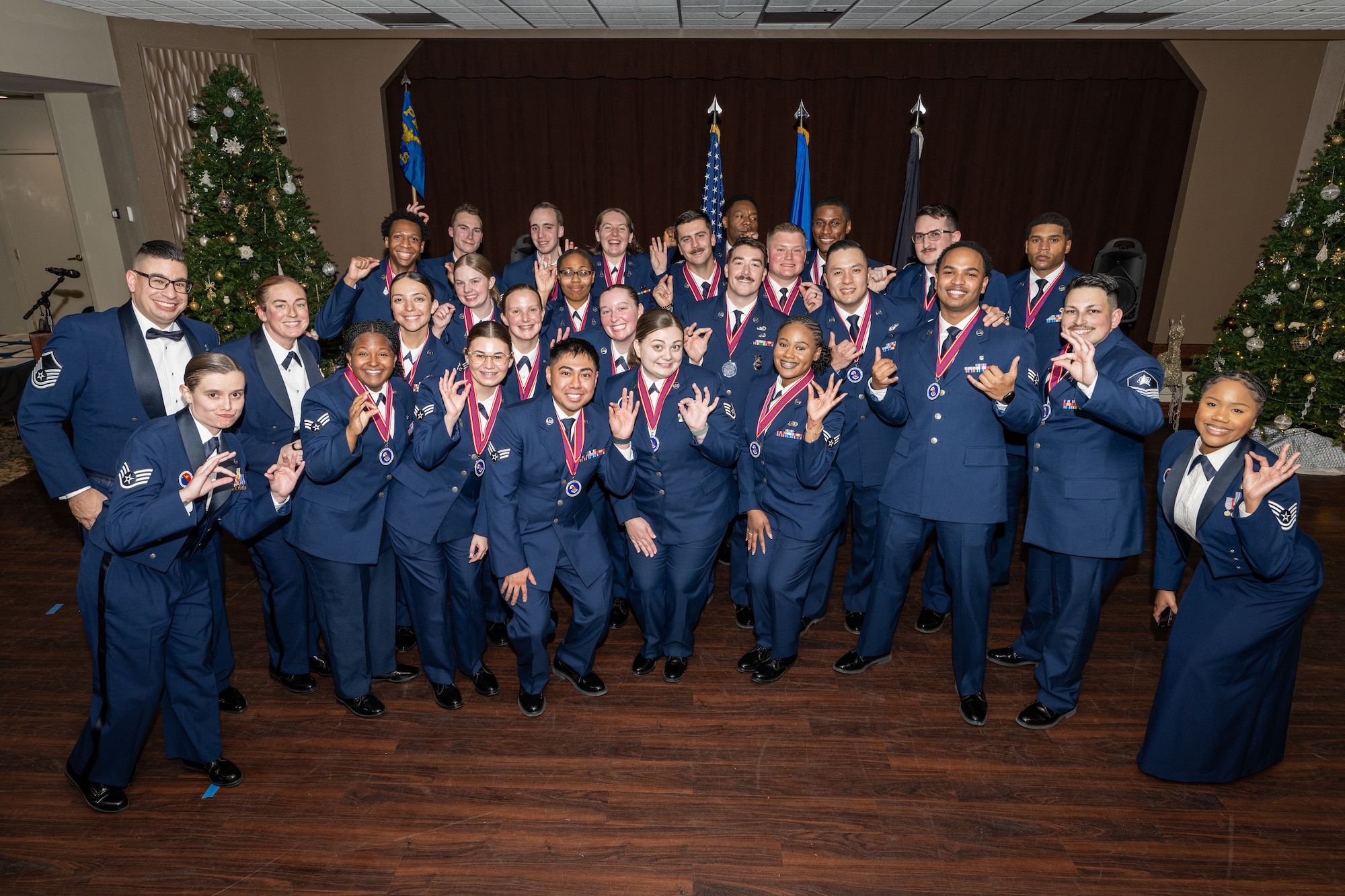 A large group photo of men and women in formal Air Force dress uniforms