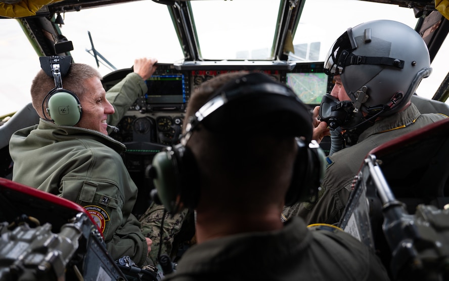 U.S. Navy Adm. Rich Correll (left), is shown the interior of a B-52H Stratofortress' cockpit by two 69th Bomb Squadron aircrew members.