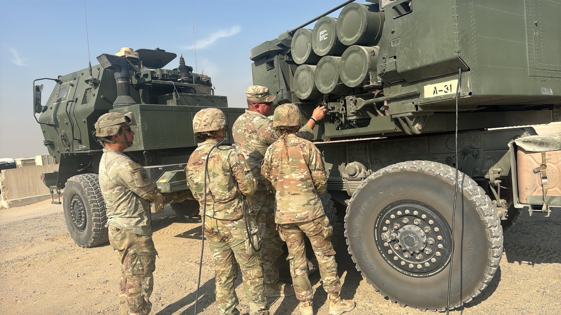 U.S. Army Sgt. 1st Class David Hughes instructs Soldiers how to properly connect the cables between the pod and launcher during a military occupational specialty transition course at Camp Arifjan, Kuwait, held Oct. 31 through Nov. 16, 2025.