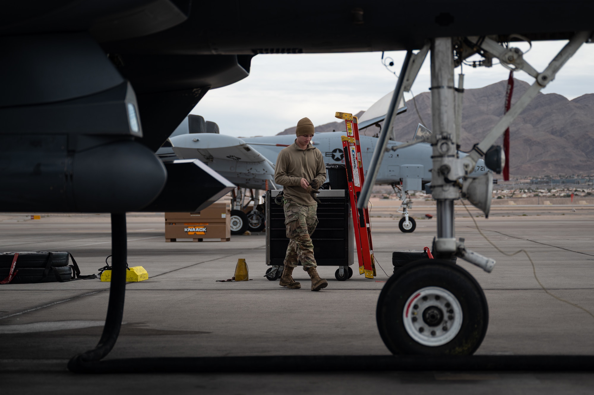a person walks past a jet