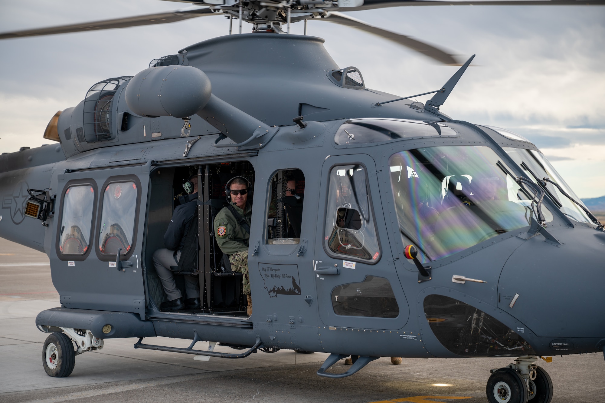 A man sitting inside of a helicopter