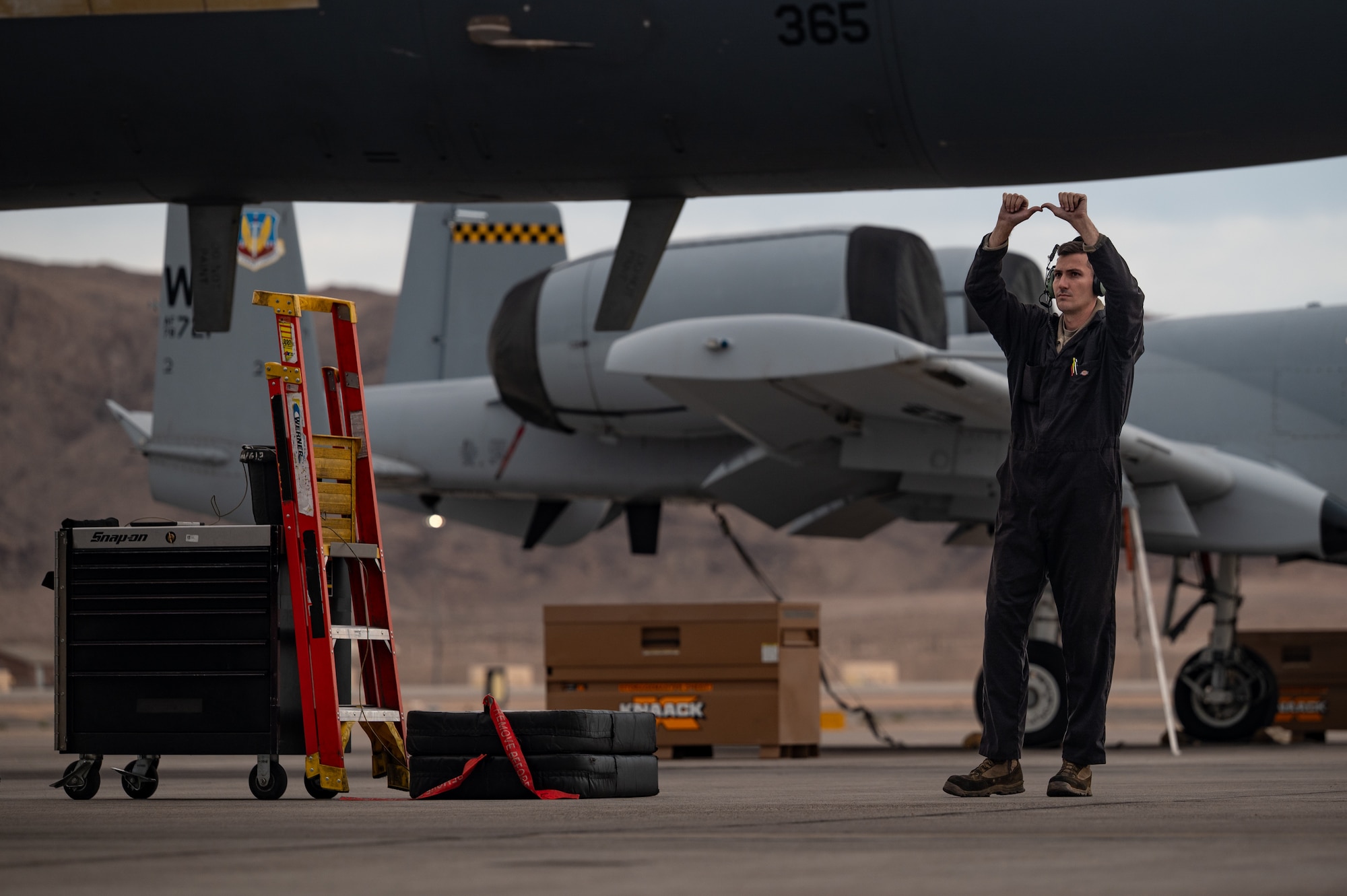 a person marshals a jet