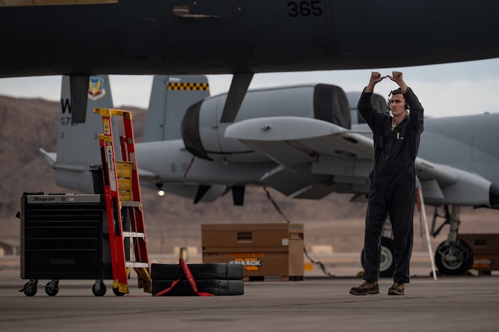 a person marshals a jet
