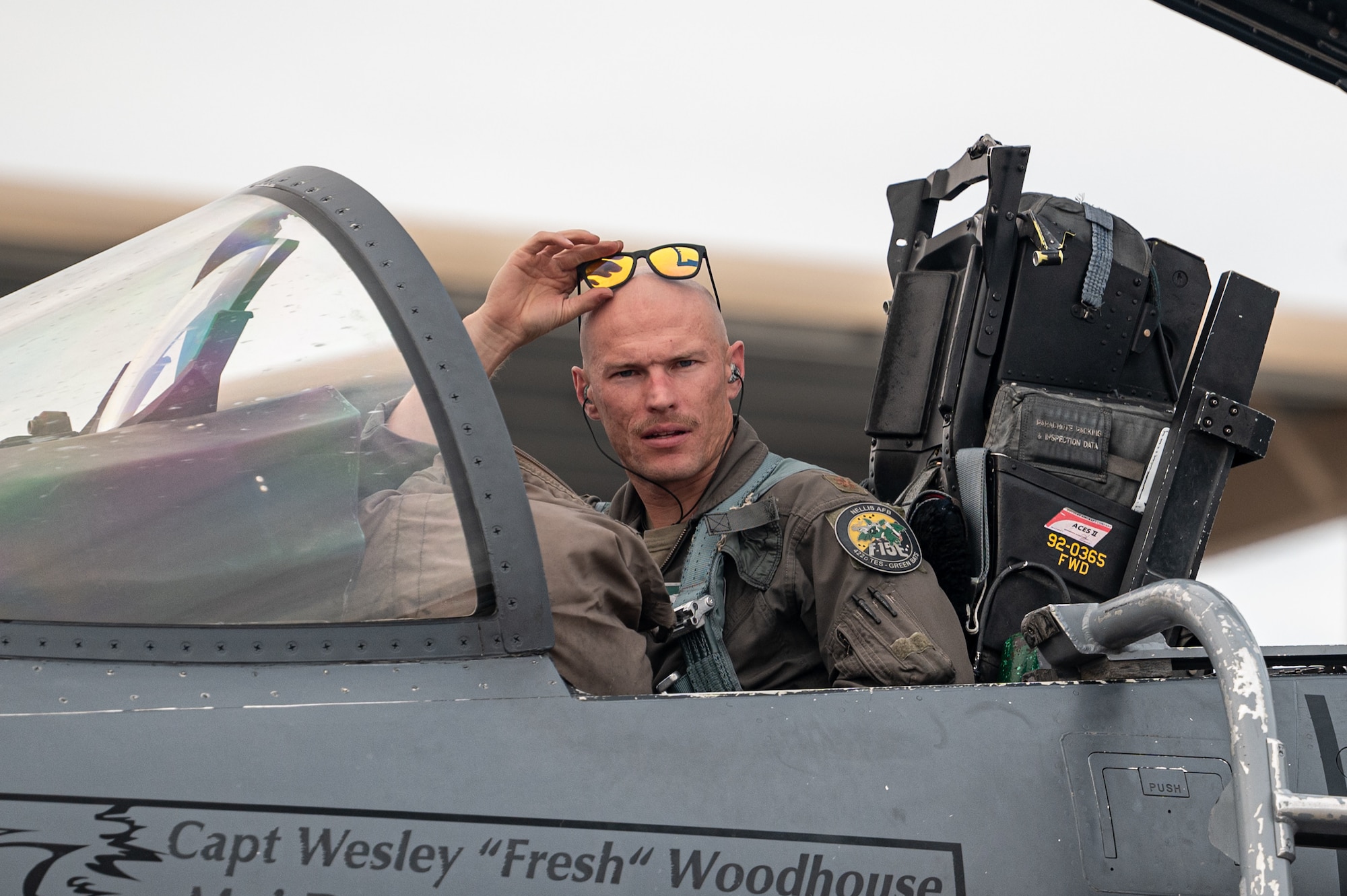 a pilot sits in a jet