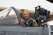 a pilot sits in a jet