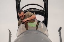 a person looks at a jet window