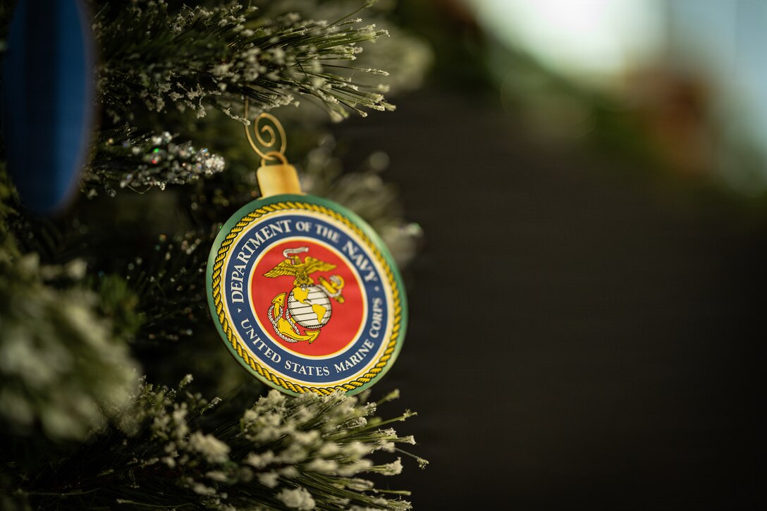 A U.S. Marine Corps ornament hangs from a Christmas tree at a Toys for Toys charity event at the Pentagon, Washington, D.C., Dec. 9, 2025. Since 1947, the Marine Corps Reserve has spearheaded the Toys for Tots program nationwide to collect toys for less fortunate children during the holiday season. Presently, the program distributes 7 to 18 million toys to children annually. (U.S. Marine Corps photo by Lance Cpl. Van Hoang)