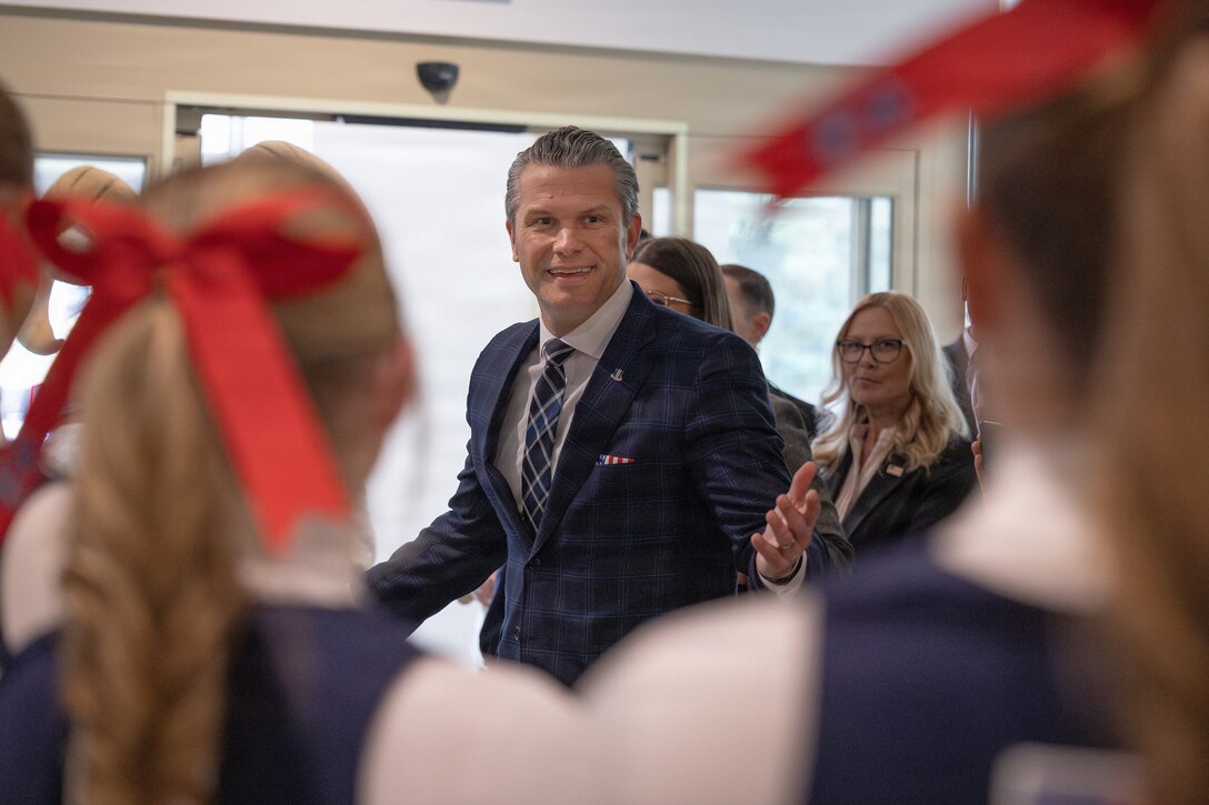 The Honorable Pete Hegseth, U.S. Secretary of War, addresses Marines participating in a Toys for Tots charity drive and members of the U.S. Naval Academy at the Pentagon, Washington, D.C., Dec. 9, 2025. Since 1947, the Marine Corps Reserve has spearheaded the Toys for Tots program nationwide to collect toys for less fortunate children during the holiday season. Presently, the program distributes 7 to 18 million toys to children annually. (U.S. Marine Corps photo by Lance Cpl. Van Hoang)