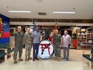 III Marine Expeditionary Force personnel meet with Pacific Multi Domain Training and Experimentation Capability Program Manager Dr. Andre Stridiron to brief him on their small unmanned aircraft systems virtual trainer equipment and course, and demonstrate their capability to design, manufacture, repair, and deploy small unmanned systems, at Camp Hansen, Okinawa, October 30, 2025.