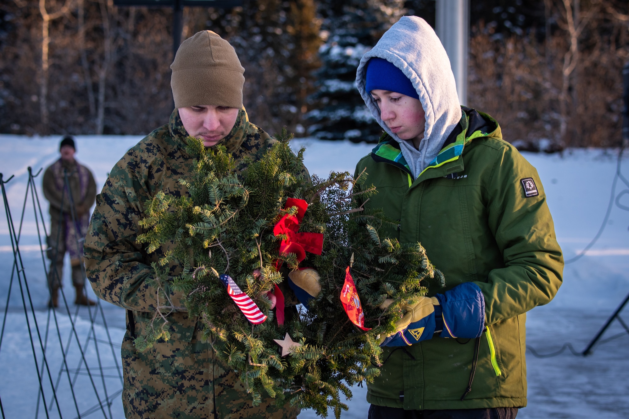 The ceremony opened with the presentation of wreaths honoring service members from every branch of the U.S. military. A member from each branch of service alongside a partner from the Alaska community carefully placed a wreath on display and rendered a salute in memory of their fallen brothers and sisters in arms. Following the presentation, approximately 400 volunteers including families, friends, service members and community members dispersed throughout the cemetery to place wreaths at gravesites, ensuring every hero was honored.