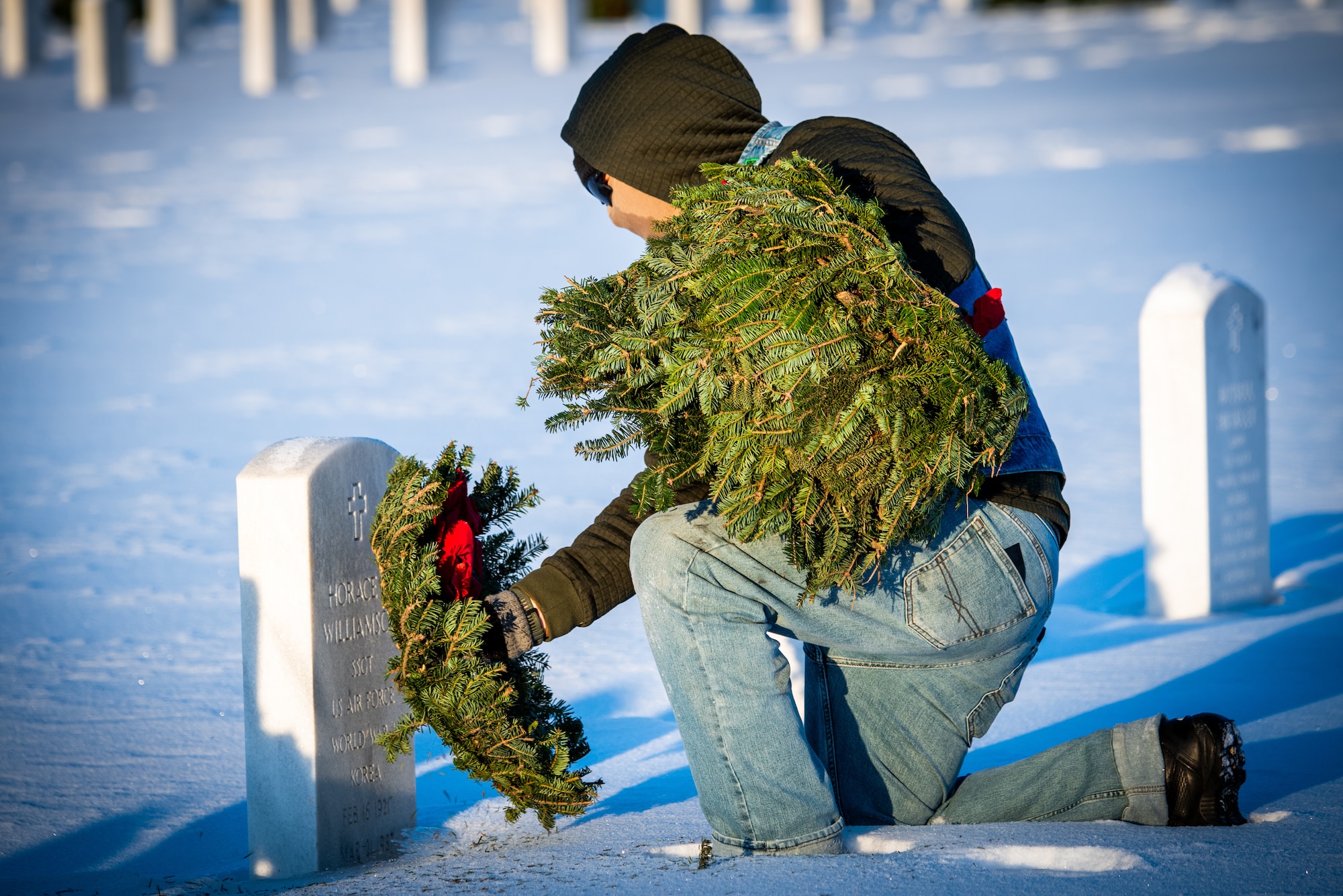 The ceremony opened with the presentation of wreaths honoring service members from every branch of the U.S. military. A member from each branch of service alongside a partner from the Alaska community carefully placed a wreath on display and rendered a salute in memory of their fallen brothers and sisters in arms. Following the presentation, approximately 400 volunteers including families, friends, service members and community members dispersed throughout the cemetery to place wreaths at gravesites, ensuring every hero was honored.